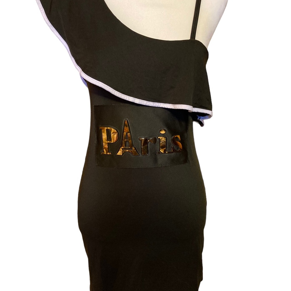 Uni shoulder ruffle detail mini dress embellished with puffy gold “PARIS”.